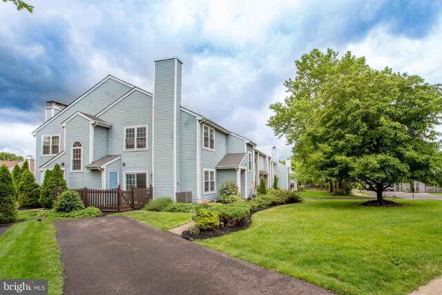 144 Carousel Cir, Doylestown, PA 18901 - view of front of property with a chimney and cooling unit