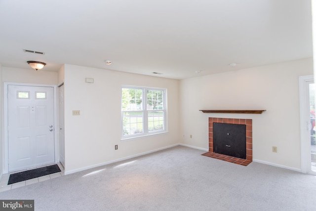 144 Carousel Cir, Doylestown, PA 18901 - unfurnished living room featuring carpet flooring, a tiled fireplace, and baseboards