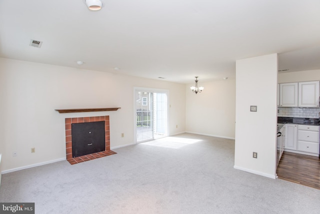 144 Carousel Cir, Doylestown, PA 18901 - unfurnished living room with carpet floors, a chandelier, a tile fireplace, and baseboards