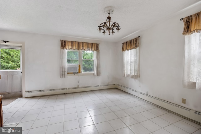 3962 Bensalem Blvd, Bensalem, PA 19020 - spare room with plenty of natural light, a textured ceiling, a baseboard radiator, a chandelier, and cooling unit