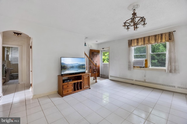 3962 Bensalem Blvd, Bensalem, PA 19020 - living room featuring arched walkways, a baseboard heating unit, light tile patterned floors, cooling unit, and a textured ceiling