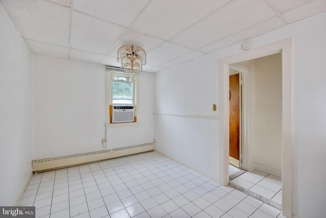 3962 Bensalem Blvd, Bensalem, PA 19020 - spare room featuring a baseboard radiator, a paneled ceiling, a chandelier, cooling unit, and light tile patterned flooring