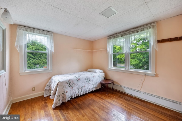 3962 Bensalem Blvd, Bensalem, PA 19020 - bedroom with a baseboard radiator, wood finished floors, and baseboards
