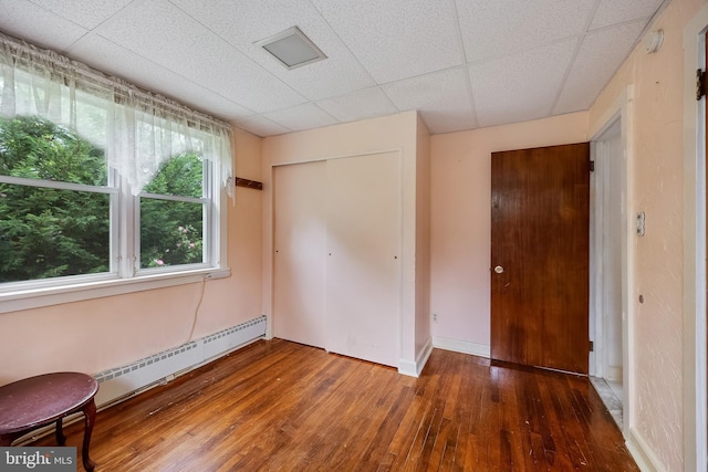 3962 Bensalem Blvd, Bensalem, PA 19020 - unfurnished bedroom with wood-type flooring, a baseboard radiator, a closet, and baseboards