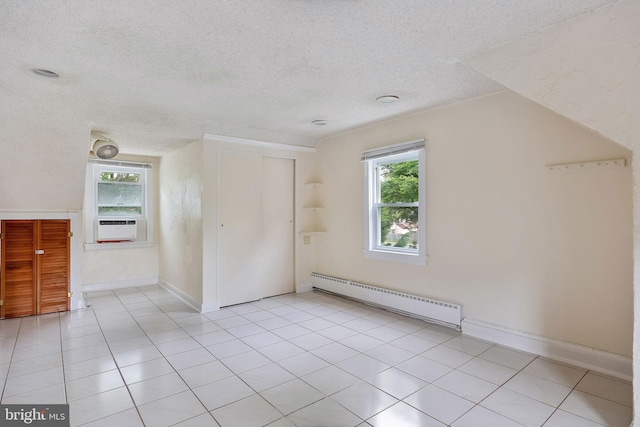 3962 Bensalem Blvd, Bensalem, PA 19020 - unfurnished bedroom featuring a baseboard radiator, a textured ceiling, multiple windows, a closet, and light tile patterned flooring