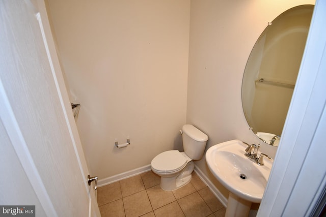 11665 Leesborough Cir, Silver Spring, MD 20902 - bathroom with tile patterned flooring, toilet, a sink, and baseboards