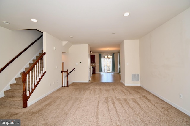 11665 Leesborough Cir, Silver Spring, MD 20902 - unfurnished living room with light carpet, arched walkways, baseboards, a chandelier, and recessed lighting