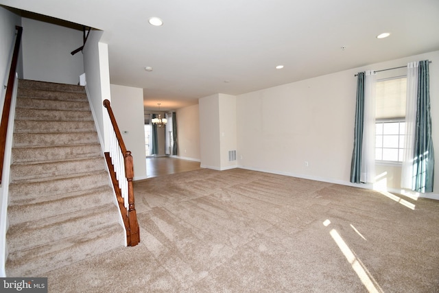 11665 Leesborough Cir, Silver Spring, MD 20902 - unfurnished living room featuring carpet floors, a chandelier, stairs, recessed lighting, and baseboards