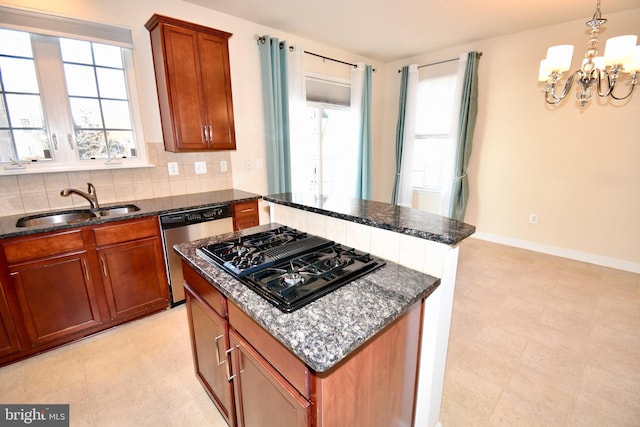11665 Leesborough Cir, Silver Spring, MD 20902 - kitchen featuring black gas stovetop, dishwasher, a sink, a chandelier, and dark stone countertops