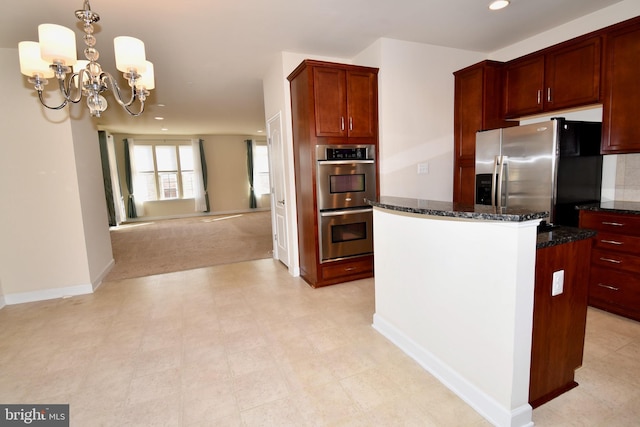 11665 Leesborough Cir, Silver Spring, MD 20902 - kitchen with stainless steel appliances, a chandelier, a center island, dark stone counters, and recessed lighting