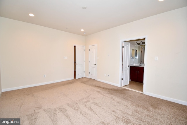 11665 Leesborough Cir, Silver Spring, MD 20902 - unfurnished room featuring light colored carpet, recessed lighting, baseboards, and a sink