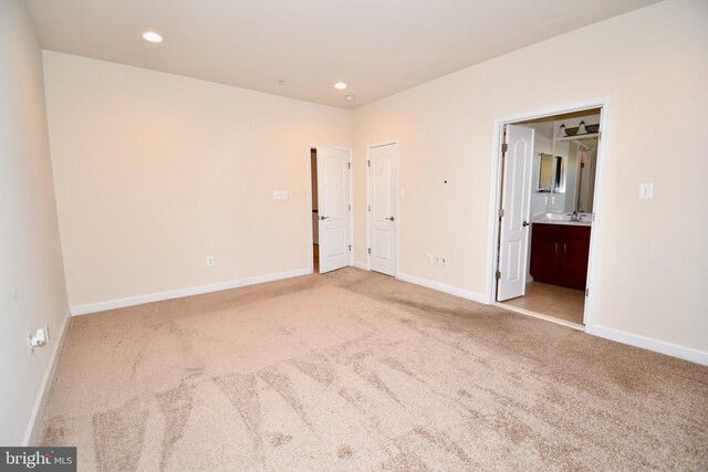 11665 Leesborough Cir, Silver Spring, MD 20902 - unfurnished bedroom with carpet, baseboards, recessed lighting, ensuite bathroom, and a sink