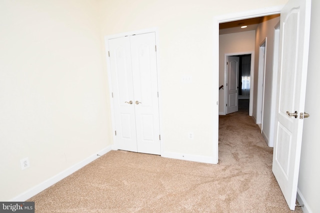 11665 Leesborough Cir, Silver Spring, MD 20902 - unfurnished bedroom featuring carpet flooring, a closet, and baseboards