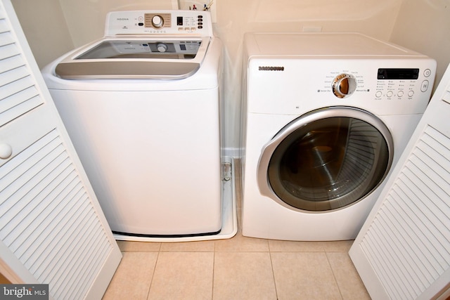 11665 Leesborough Cir, Silver Spring, MD 20902 - laundry room with washer and clothes dryer and tile patterned floors
