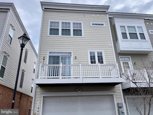 11665 Leesborough Cir, Silver Spring, MD 20902 - rear view of property featuring a balcony and a garage