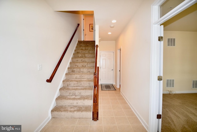 11665 Leesborough Cir, Silver Spring, MD 20902 - stairway featuring recessed lighting, baseboards, tile patterned flooring, and carpet