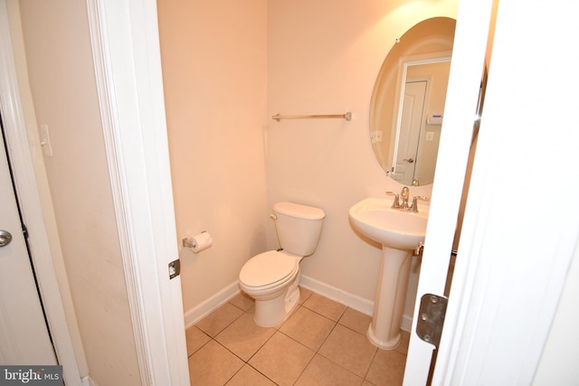 11665 Leesborough Cir, Silver Spring, MD 20902 - bathroom with toilet, tile patterned floors, baseboards, and a sink