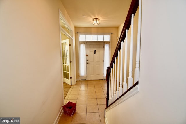 11665 Leesborough Cir, Silver Spring, MD 20902 - foyer featuring light tile patterned floors, baseboards, and stairway