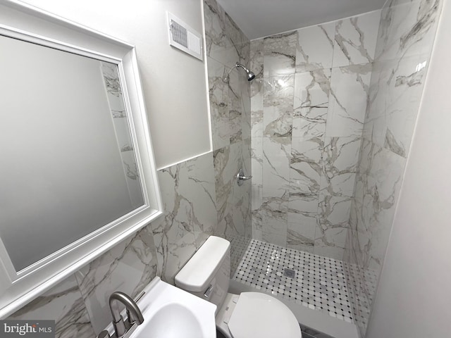 1165 Atwood Rd, Philadelphia, PA 19151 - full bath with a marble finish shower, tile walls, toilet, and a sink