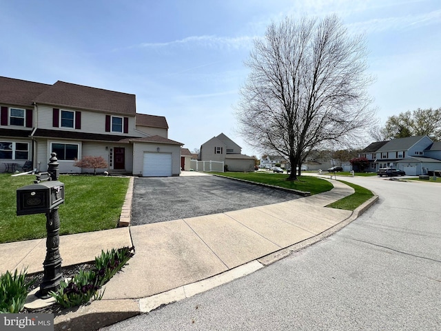 2331 Cambridge Cir, Hatfield, PA 19440 - view of front of home with an attached garage, a residential view, and driveway