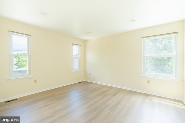 2331 Cambridge Cir, Hatfield, PA 19440 - empty room with light wood-style floors, healthy amount of natural light, and baseboards