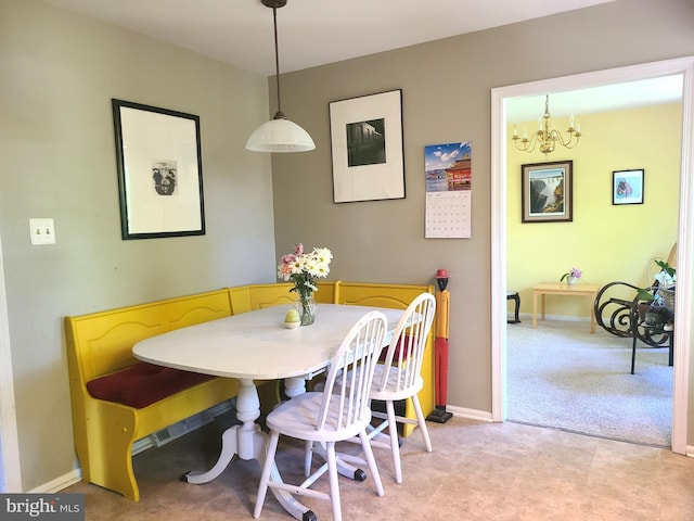 302 Old Lancaster Rd, Devon, PA 19333 - dining room featuring light colored carpet, a chandelier, and baseboards