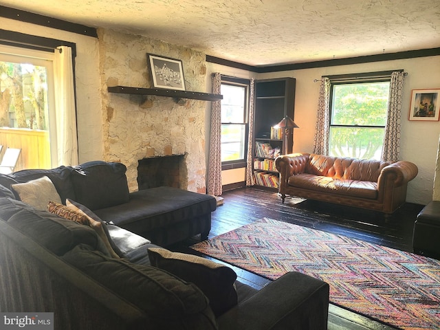 302 Old Lancaster Rd, Devon, PA 19333 - living area with hardwood / wood-style flooring, a textured ceiling, and a fireplace