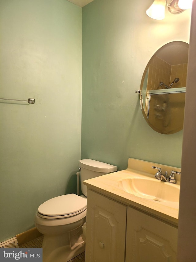 302 Old Lancaster Rd, Devon, PA 19333 - bathroom featuring vanity, toilet, a shower with door, and tile patterned floors