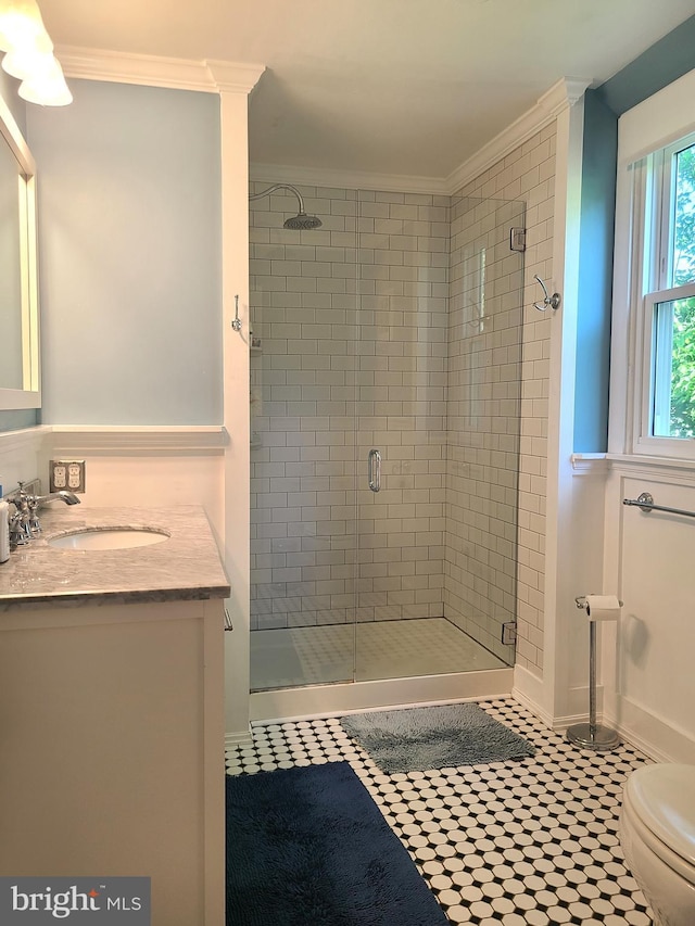 302 Old Lancaster Rd, Devon, PA 19333 - bathroom with ornamental molding, vanity, a shower stall, toilet, and tile patterned floors