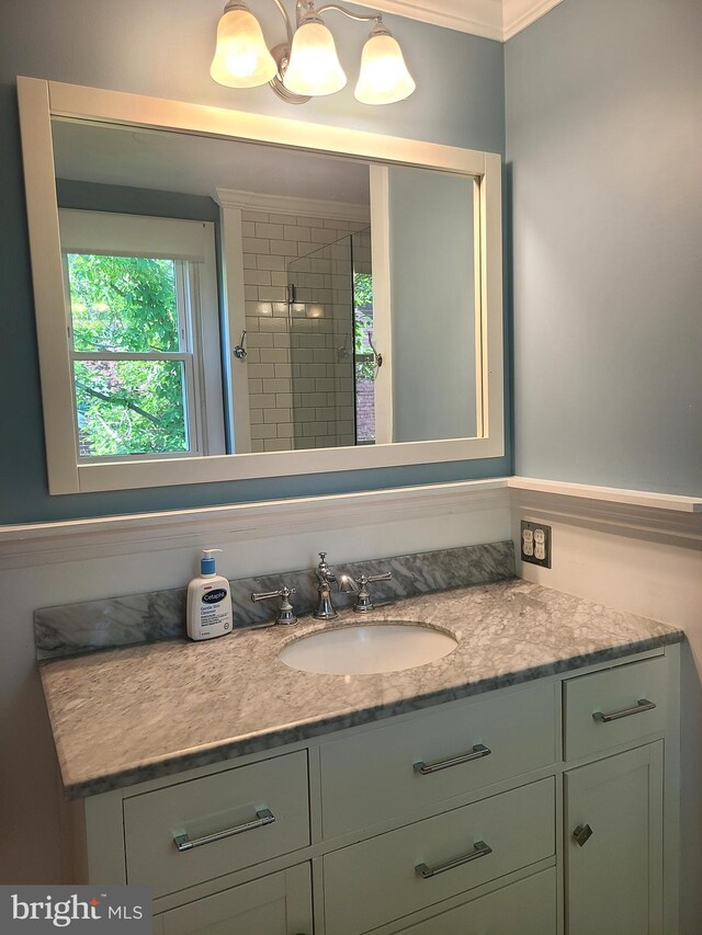302 Old Lancaster Rd, Devon, PA 19333 - bathroom featuring vanity, a tile shower, and crown molding