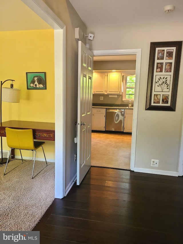 302 Old Lancaster Rd, Devon, PA 19333 - hall featuring dark wood-style flooring, baseboards, and a sink