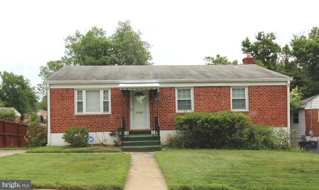 4801 Oxbow Rd, Rockville, MD 20852 - view of front of house featuring brick siding and a chimney