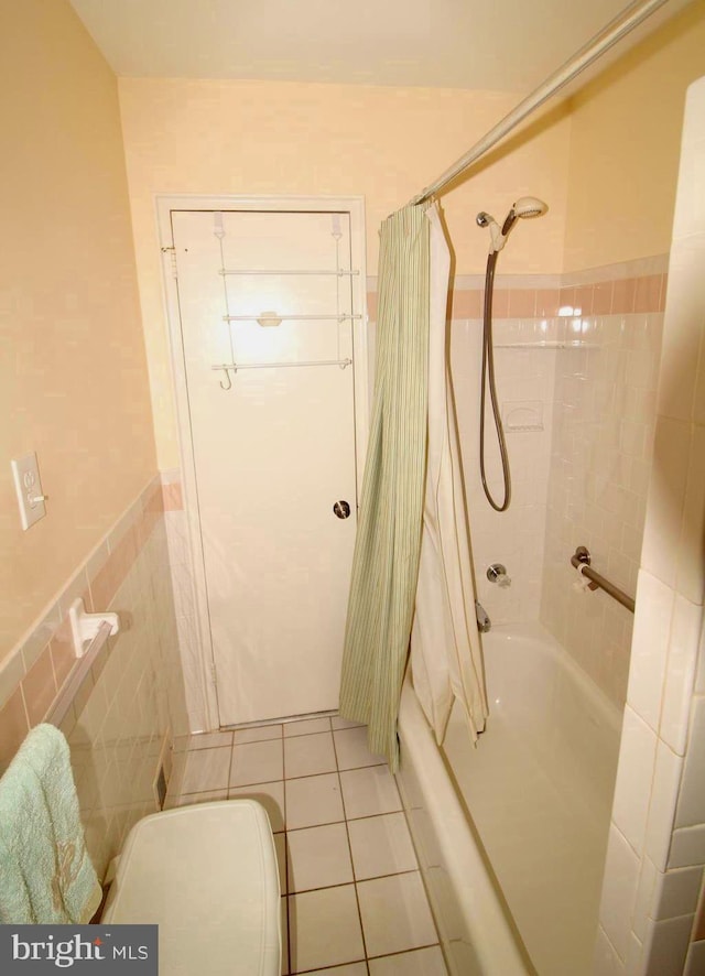 4801 Oxbow Rd, Rockville, MD 20852 - full bathroom with shower / bath combo, toilet, tile patterned flooring, wainscoting, and tile walls