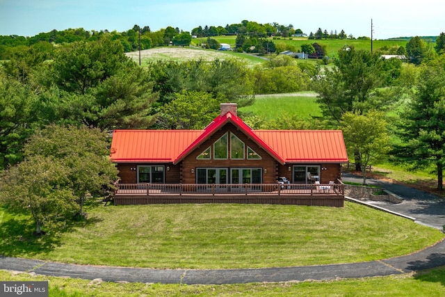 236 4th St, Herndon, PA 17830 - rear view of property with log exterior, a lawn, a deck, and view of wooded area