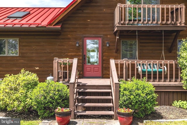 236 4th St, Herndon, PA 17830 - view of exterior entry featuring a balcony, a standing seam roof, and metal roof