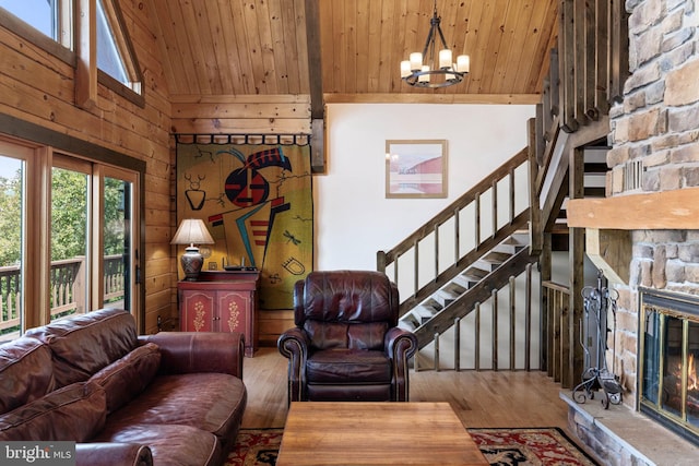 236 4th St, Herndon, PA 17830 - living room with wood ceiling, a chandelier, high vaulted ceiling, wood finished floors, and a stone fireplace