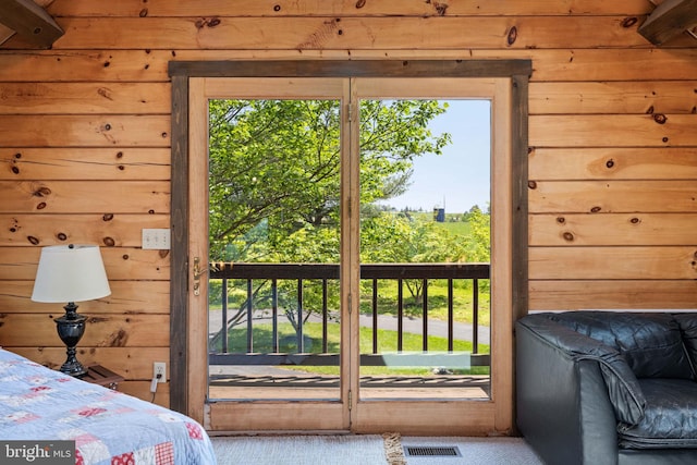 236 4th St, Herndon, PA 17830 - carpeted bedroom featuring wooden walls and multiple windows