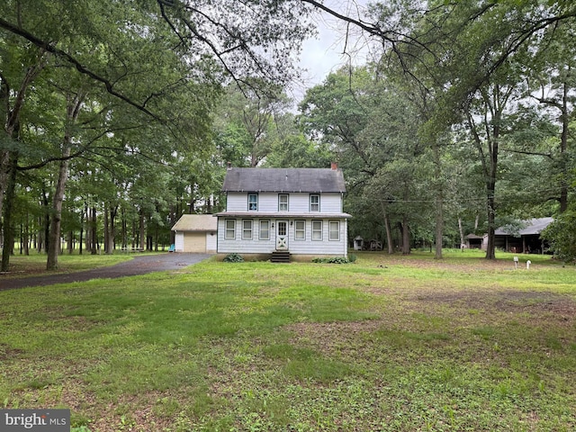 81 Hollering Hill Rd, Camden Wyoming, DE 19934 - view of front of home featuring entry steps, driveway, a front yard, and a chimney