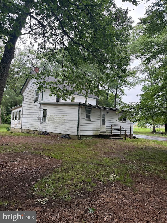 81 Hollering Hill Rd, Camden Wyoming, DE 19934 - rear view of property featuring a chimney