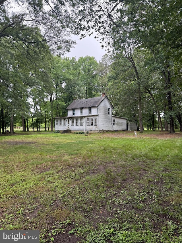 81 Hollering Hill Rd, Camden Wyoming, DE 19934 - view of front of home with a chimney and a front yard