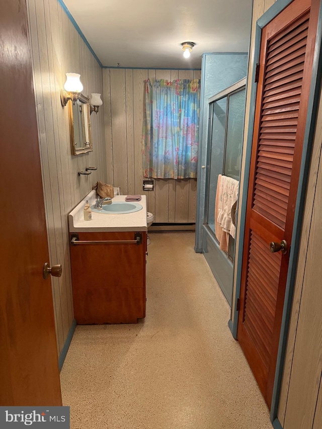 81 Hollering Hill Rd, Camden Wyoming, DE 19934 - bathroom featuring an enclosed shower, vanity, carpet flooring, toilet, and wooden walls
