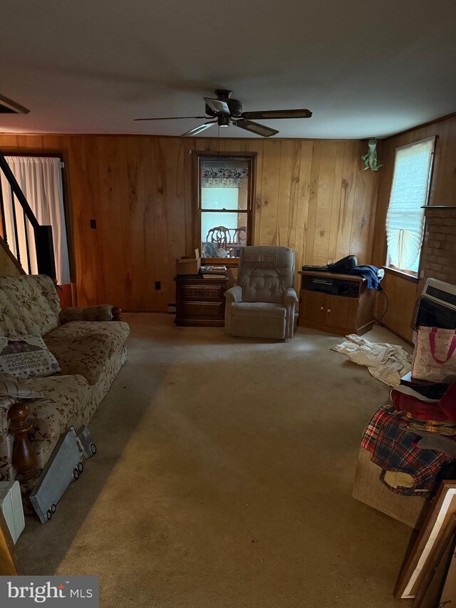 81 Hollering Hill Rd, Camden Wyoming, DE 19934 - carpeted living room with a ceiling fan and wooden walls