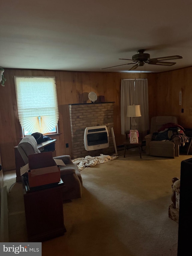 81 Hollering Hill Rd, Camden Wyoming, DE 19934 - carpeted living area with wood walls, a ceiling fan, and heating unit