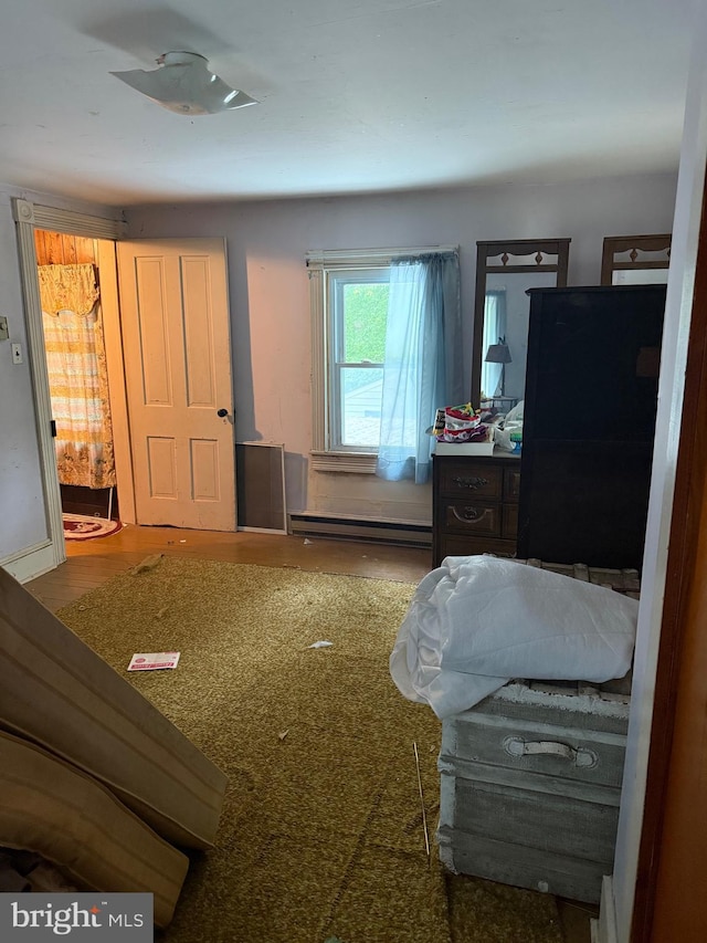 81 Hollering Hill Rd, Camden Wyoming, DE 19934 - bedroom featuring a baseboard radiator and wood finished floors