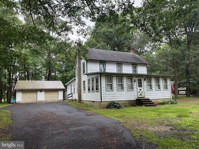 81 Hollering Hill Rd, Camden Wyoming, DE 19934 - view of front of home with a garage, an outbuilding, entry steps, a chimney, and view of scattered trees