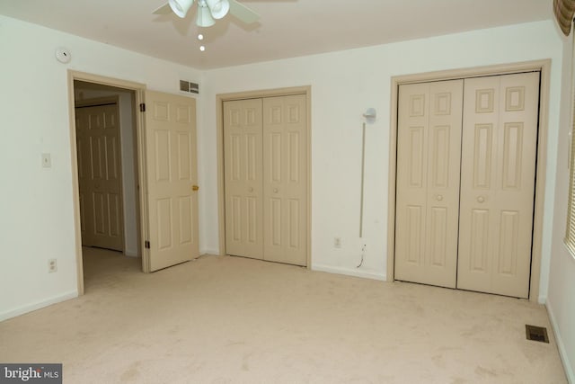 355 Norris Hall Ln Unit 355, Jeffersonville, PA 19403 - unfurnished bedroom with multiple closets, carpet, baseboards, and ceiling fan