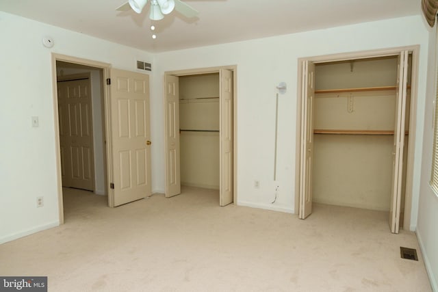 355 Norris Hall Ln Unit 355, Jeffersonville, PA 19403 - unfurnished bedroom with multiple closets, carpet, baseboards, and a ceiling fan