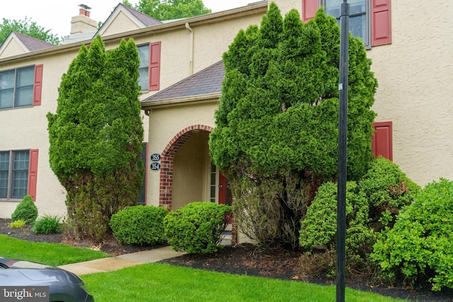 355 Norris Hall Ln Unit 355, Jeffersonville, PA 19403 - view of front of house with stucco siding and a chimney