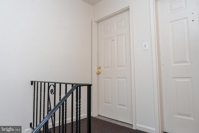 355 Norris Hall Ln Unit 355, Jeffersonville, PA 19403 - corridor featuring baseboards, an upstairs landing, and dark colored carpet