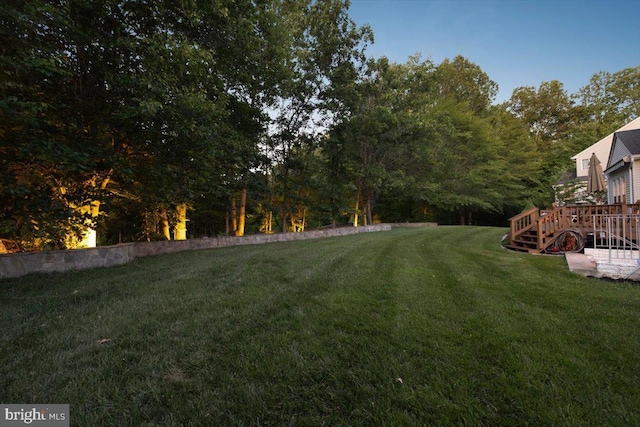 9308 Eagle Ct, Manassas Park, VA 20111 - view of grassy yard featuring a wooden deck and view of wooded area